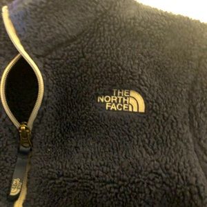 Navy fleece zip up jacket.